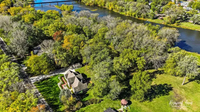 a view of a wooden house with a tree