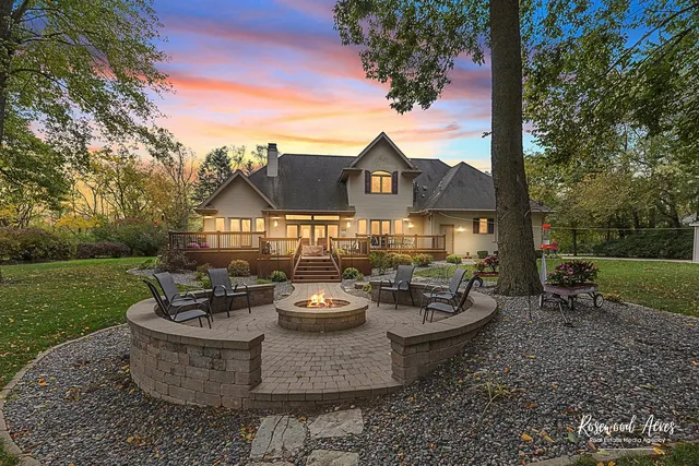 a view of a patio with couches and a table and chairs and garden