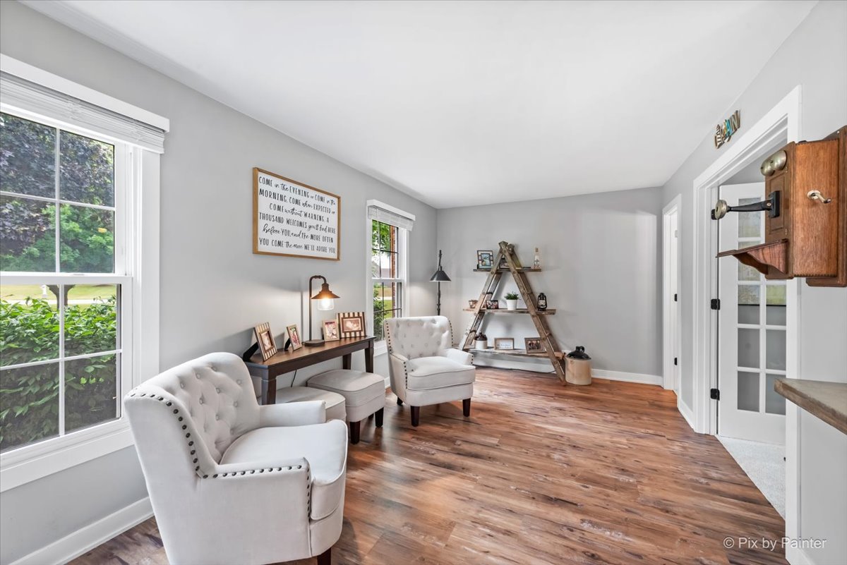 3205 Ramsgate Lane Johnsburg, IL 60051 - Photo 11 of 41 a living room with furniture or window and a wooden floor
