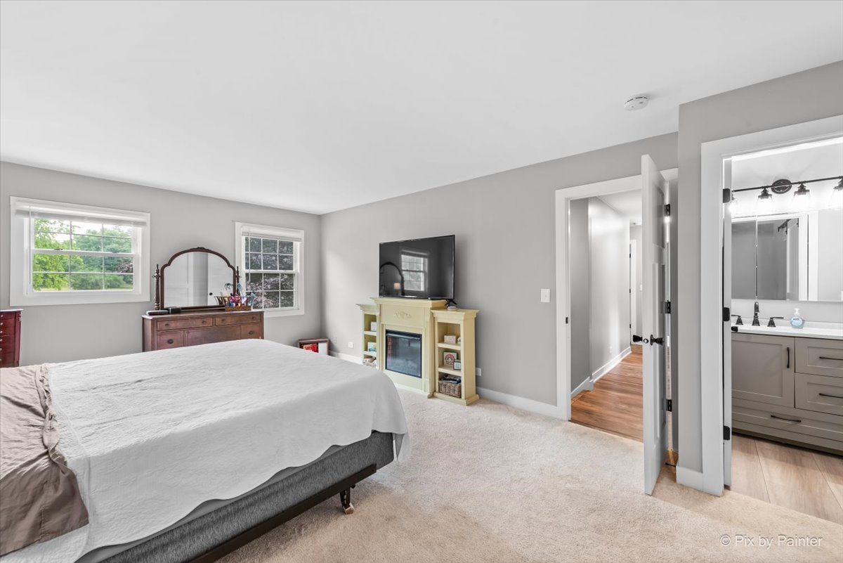 3205 Ramsgate Lane Johnsburg, IL 60051 - Photo 15 of 41 a bedroom with a bed and a flat screen tv