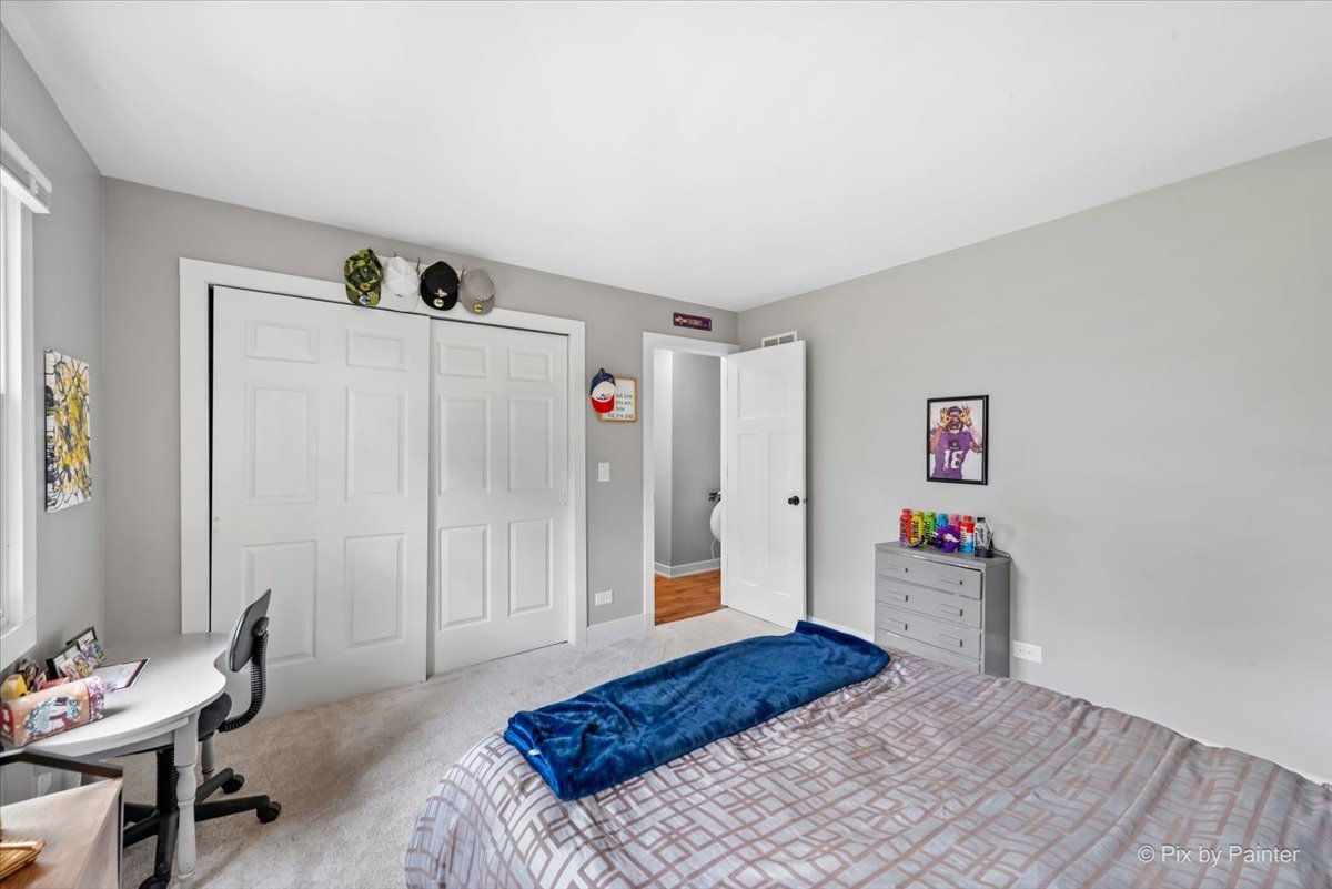 3205 Ramsgate Lane Johnsburg, IL 60051 - Photo 21 of 41 a bedroom with a bed and a window