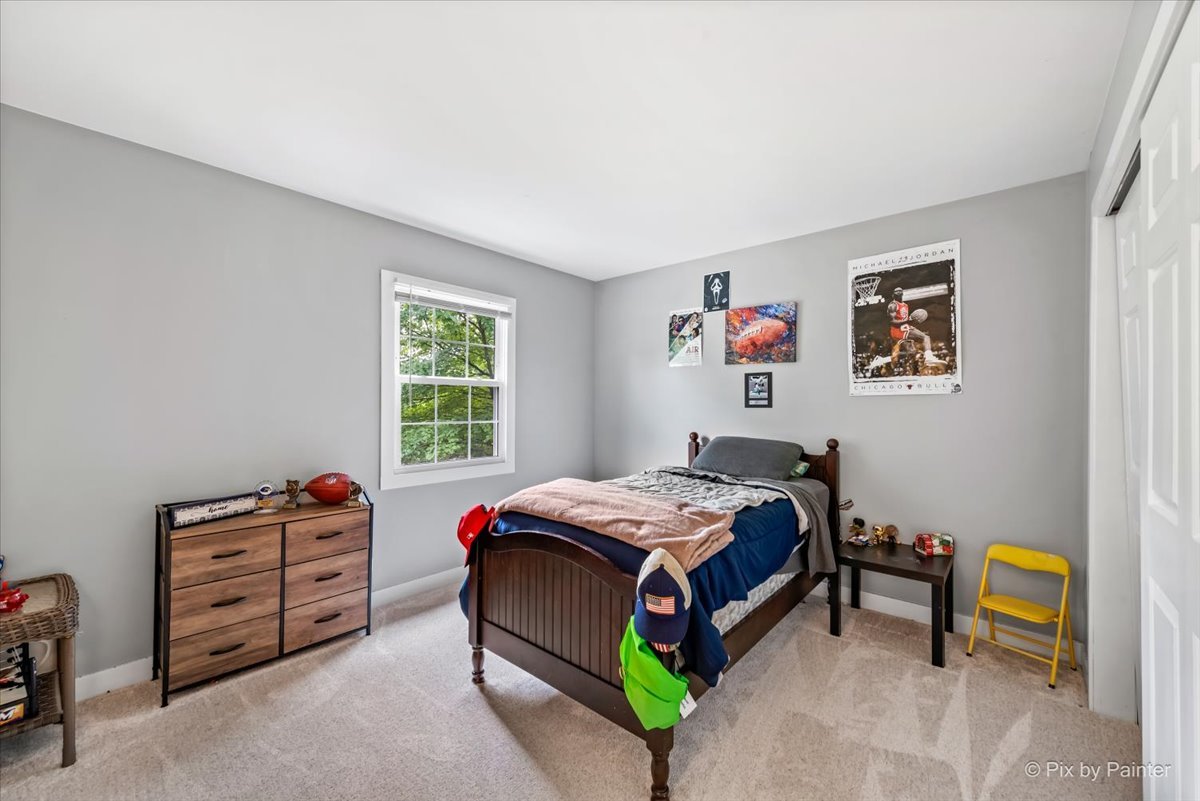 3205 Ramsgate Lane Johnsburg, IL 60051 - Photo 22 of 41 a bed room with a bed and a chair