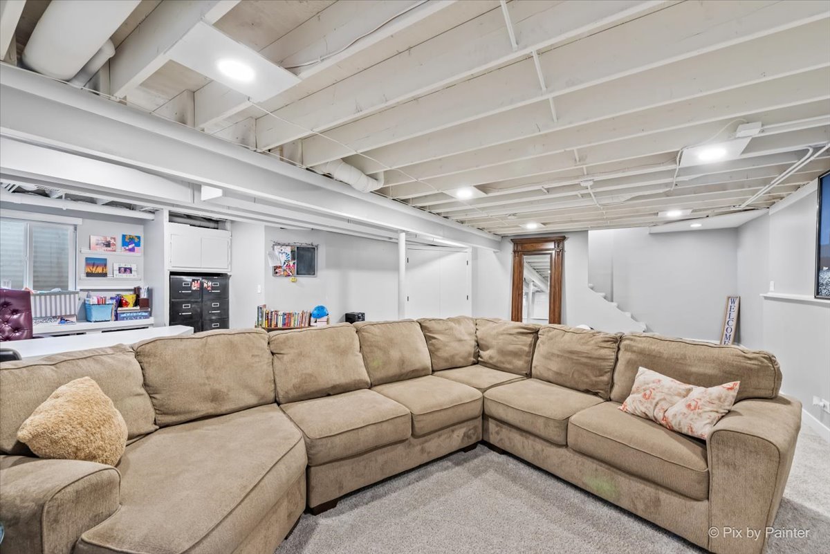 3205 Ramsgate Lane Johnsburg, IL 60051 - Photo 26 of 41 a living room with furniture and a couch