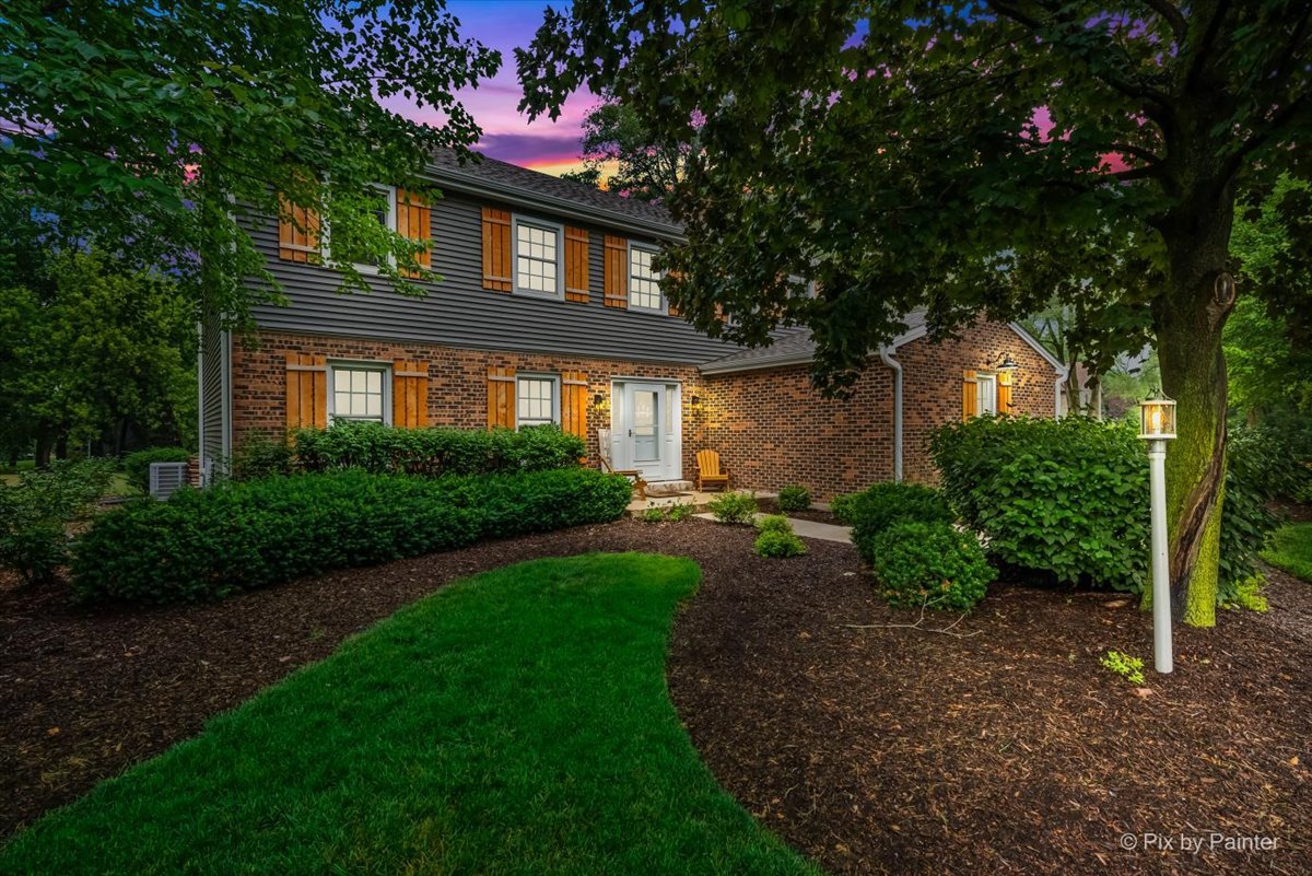 3205 Ramsgate Lane Johnsburg, IL 60051 - Photo 28 of 41 a front view of a house with garden