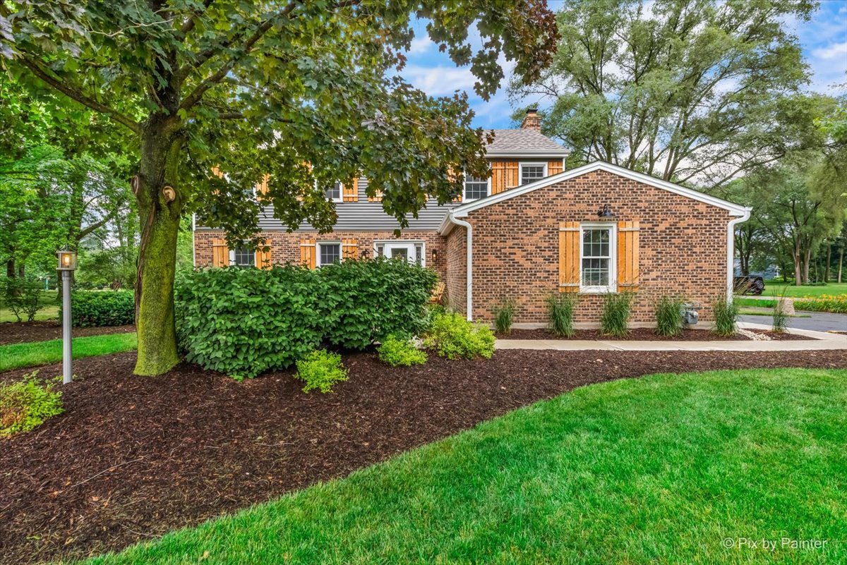 3205 Ramsgate Lane Johnsburg, IL 60051 - Photo 32 of 41 a front view of a house with a yard and trees