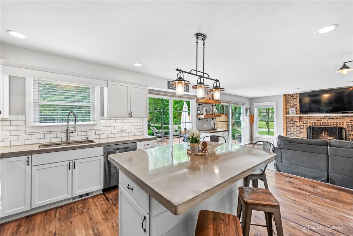 3205 Ramsgate Lane Johnsburg, IL 60051 - Photo 7 of 41 a kitchen with lots of counter top space and dining table