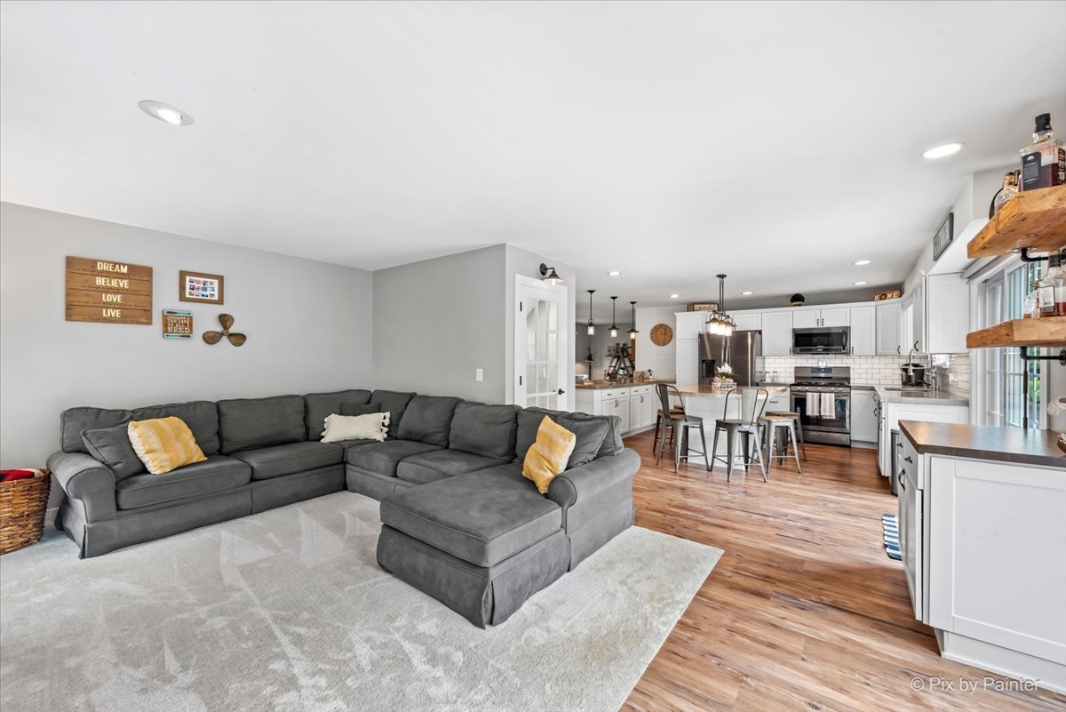 3205 Ramsgate Lane Johnsburg, IL 60051 - Photo 9 of 41 a living room with furniture and view of kitchen