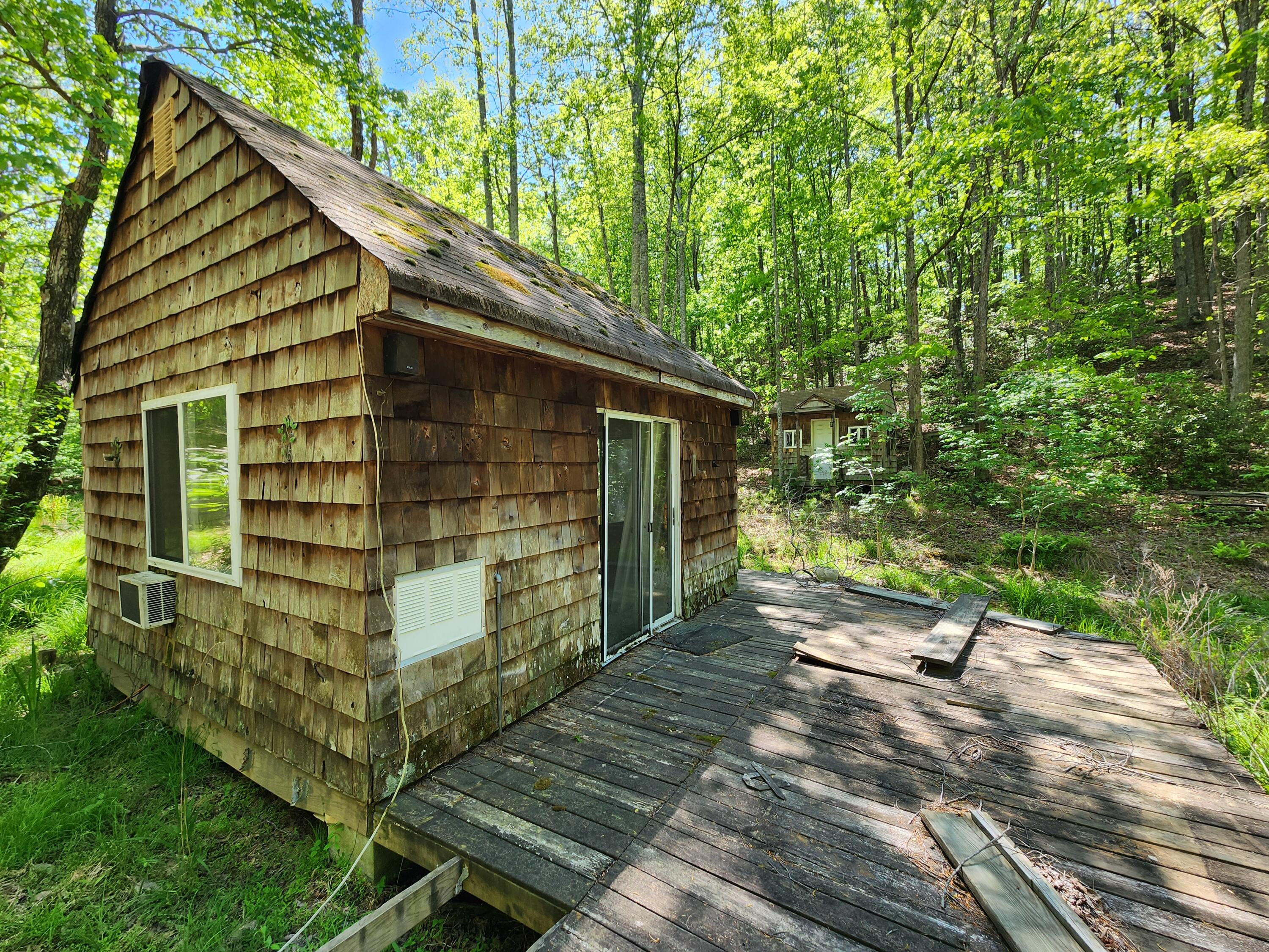 615 Faith Cove Road Sandy Level, VA 24161 - Photo 22 of 49 a front view of a house with a yard