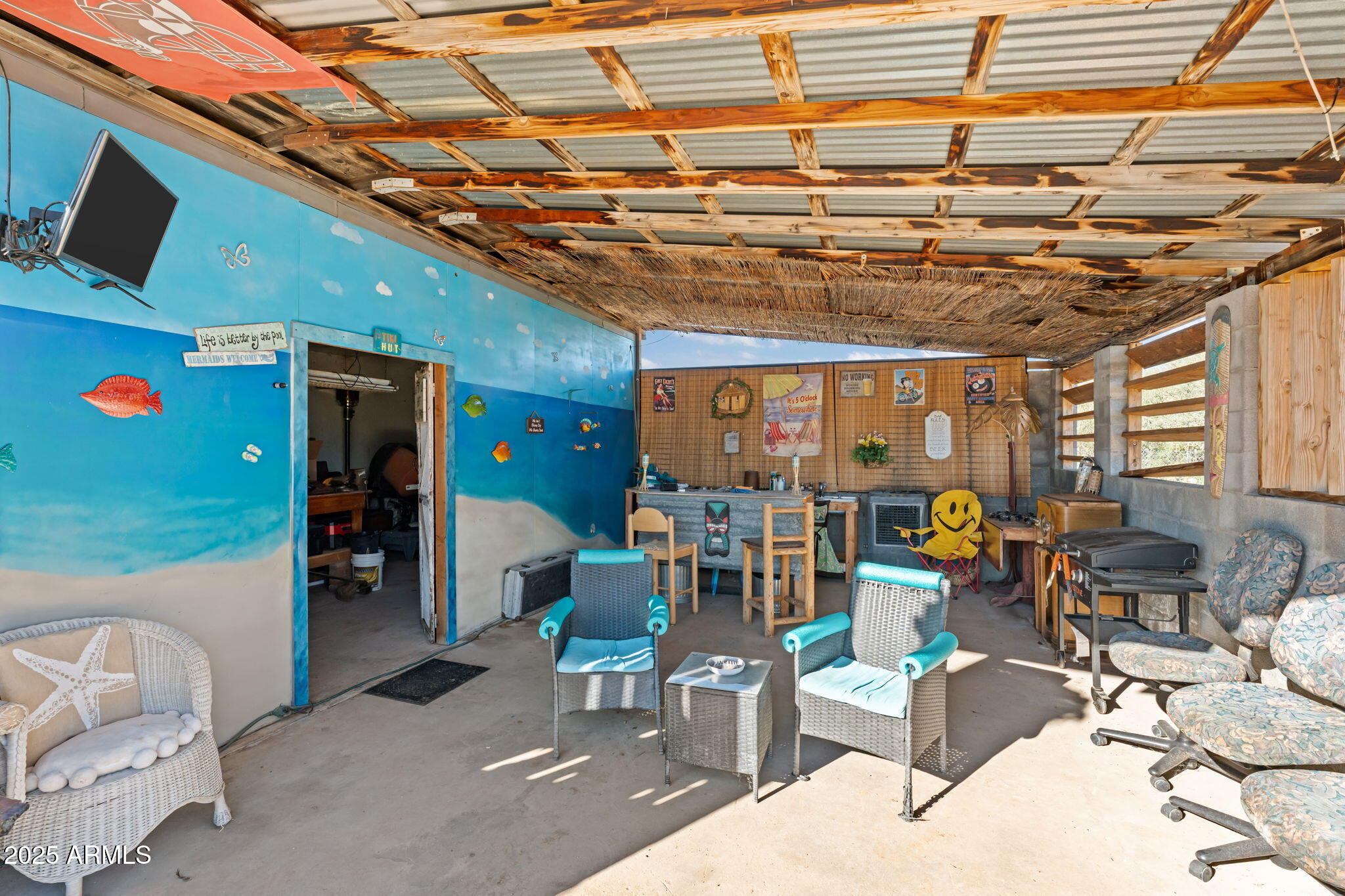22570 Pacific Street, Unit 7 Congress, AZ 85332 - Photo 5 of 7 a living room with furniture and a flat screen tv