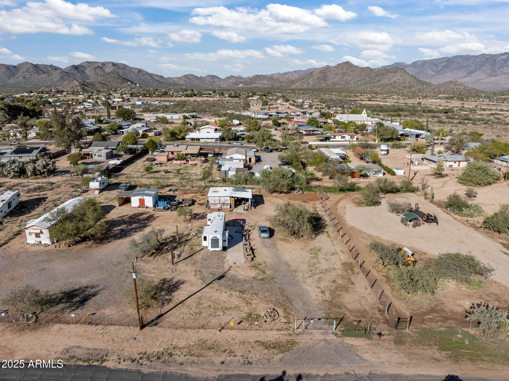 22570 Pacific Street, Unit 7 Congress, AZ 85332 - Photo 6 of 7 an aerial view of residential houses with outdoor space