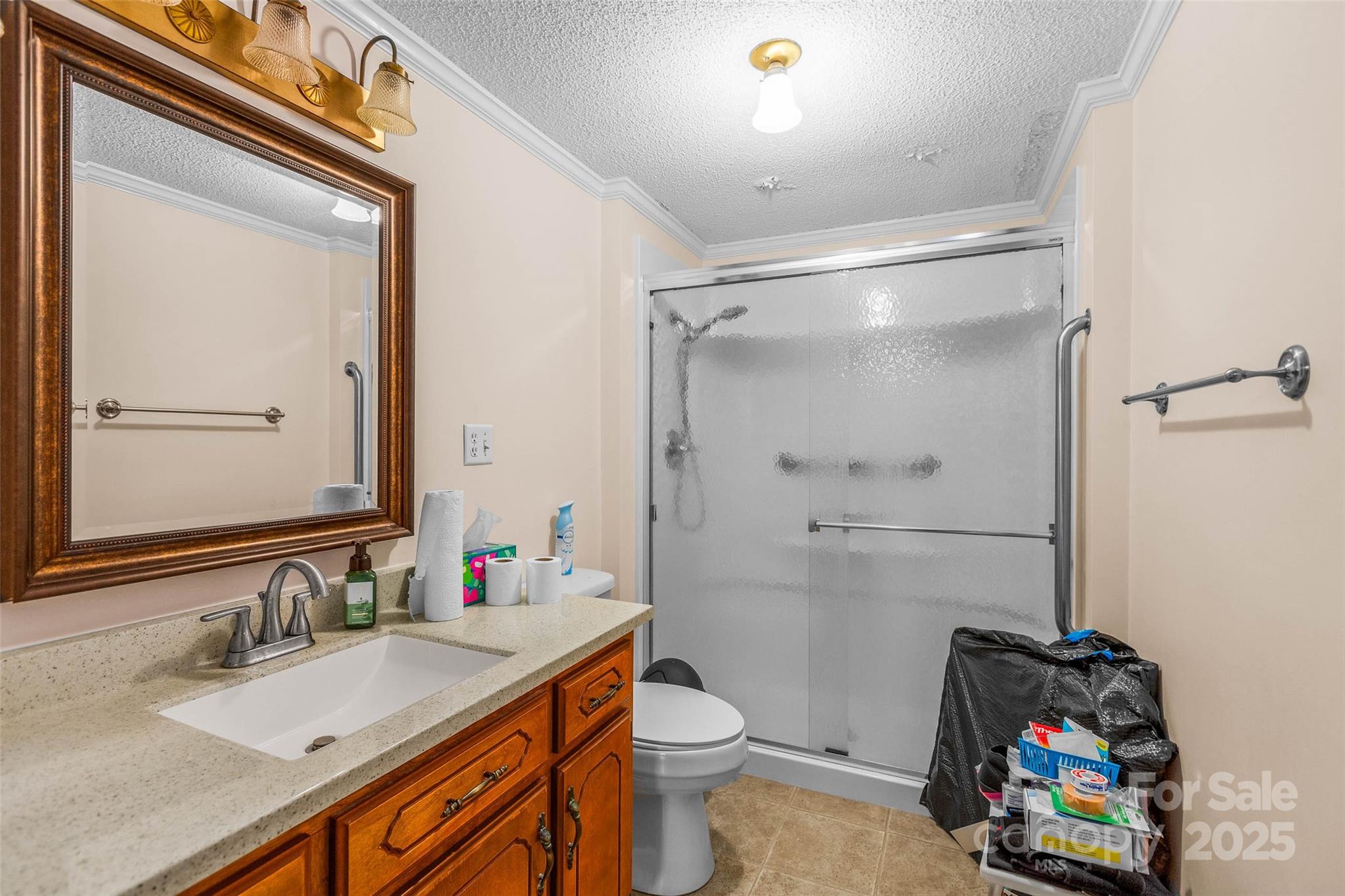 304 South Walnut Street Kannapolis, NC 28081 - Photo 12 of 32 a bathroom with a sink vanity mirror and toilet