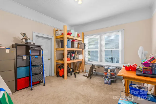 a bed room with a bed and a window