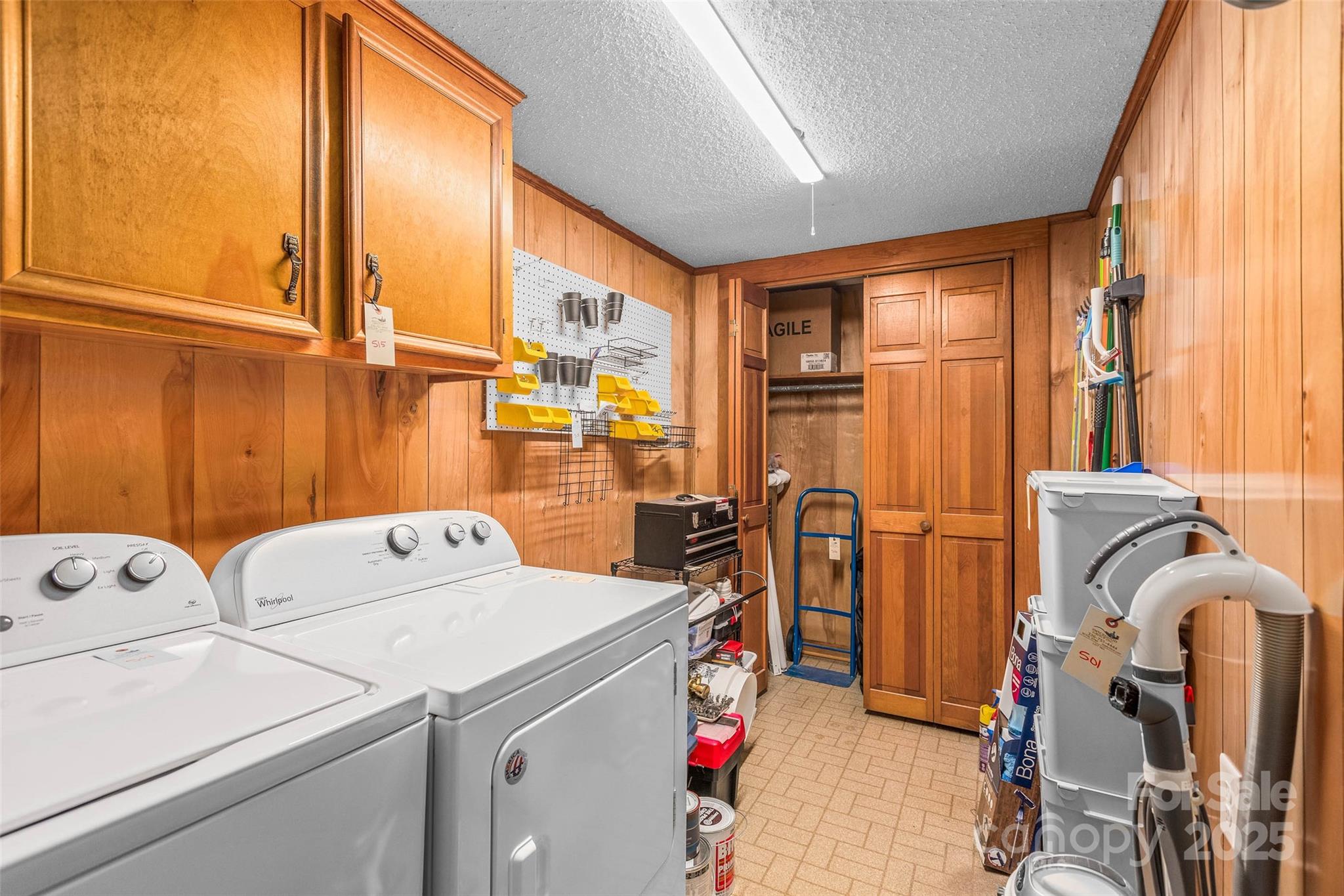 304 South Walnut Street Kannapolis, NC 28081 - Photo 15 of 32 a view of storage and utility room with washer and dryer