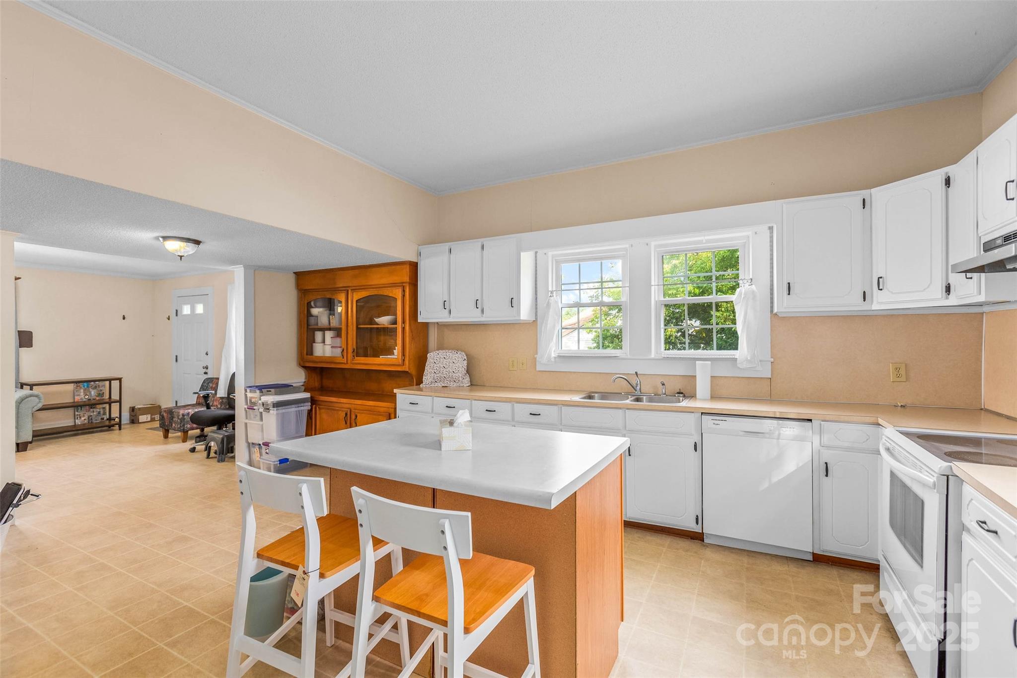 304 South Walnut Street Kannapolis, NC 28081 - Photo 17 of 32 a kitchen with a sink and chairs