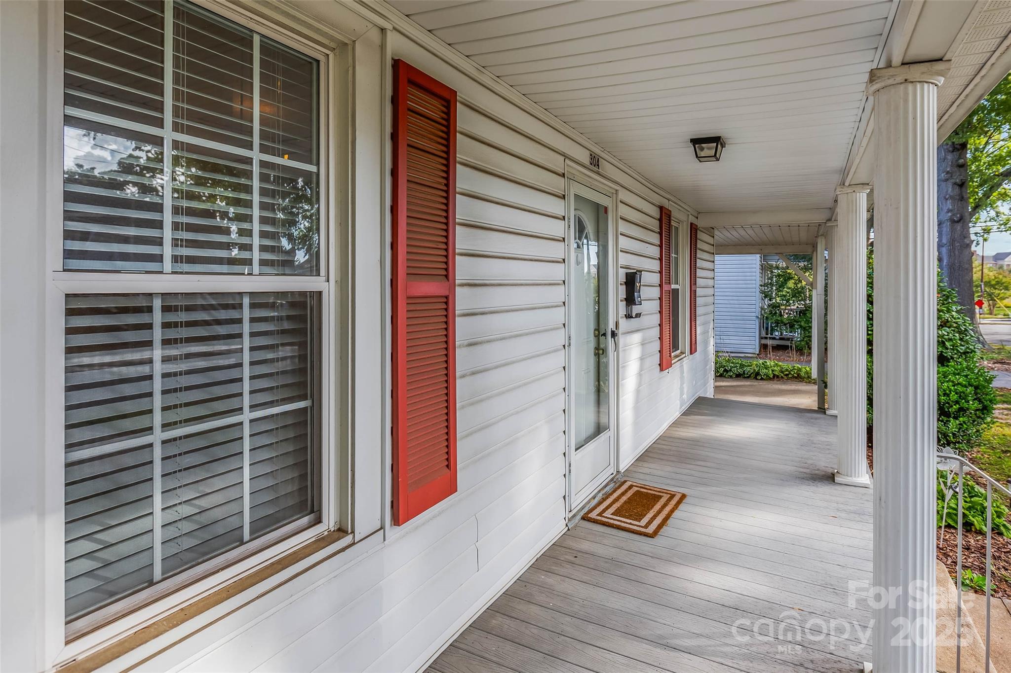 304 South Walnut Street Kannapolis, NC 28081 - Photo 5 of 32 a view of a balcony door with wooden floor