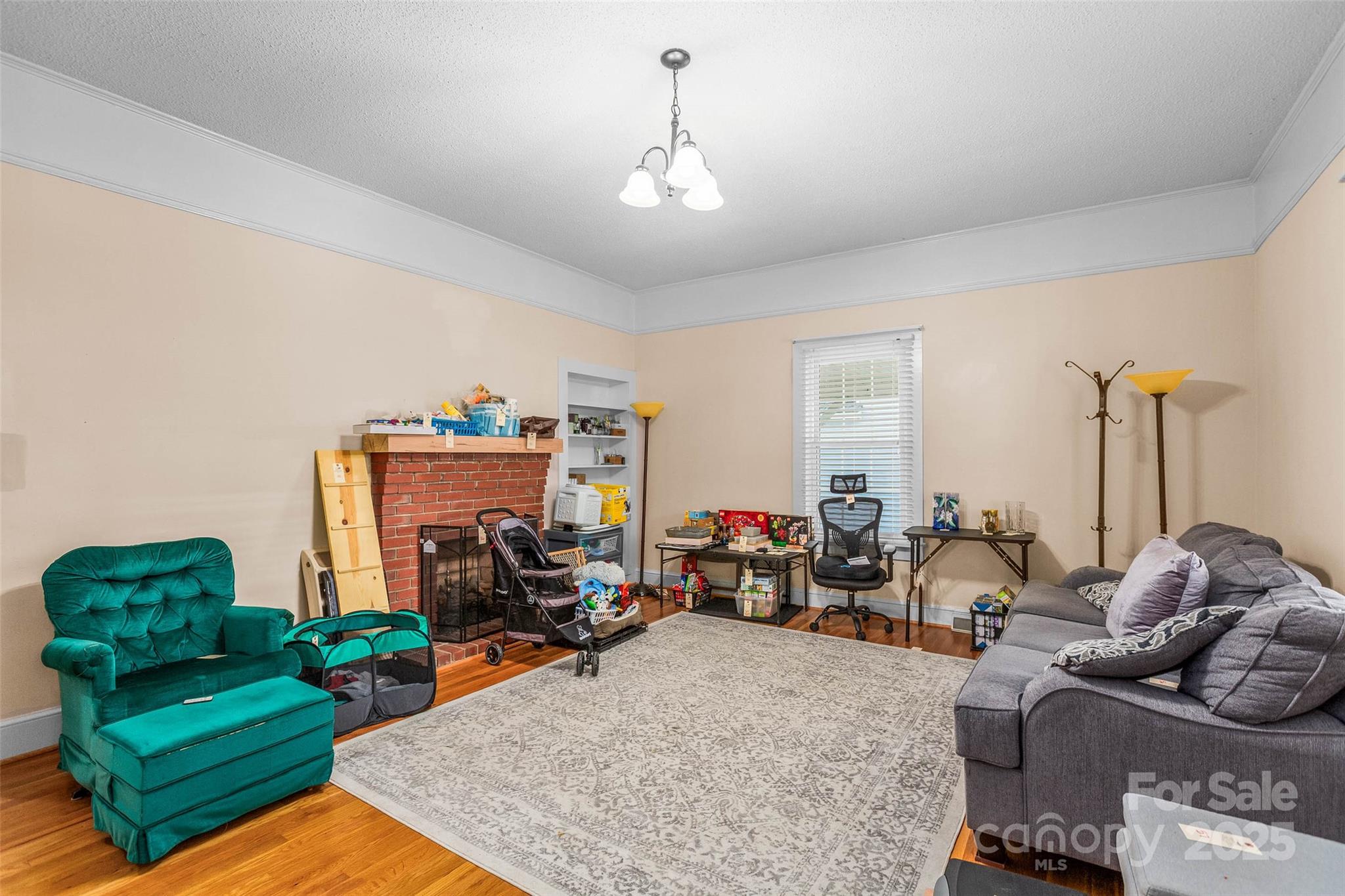 304 South Walnut Street Kannapolis, NC 28081 - Photo 7 of 32 a living room with furniture fireplace and rug