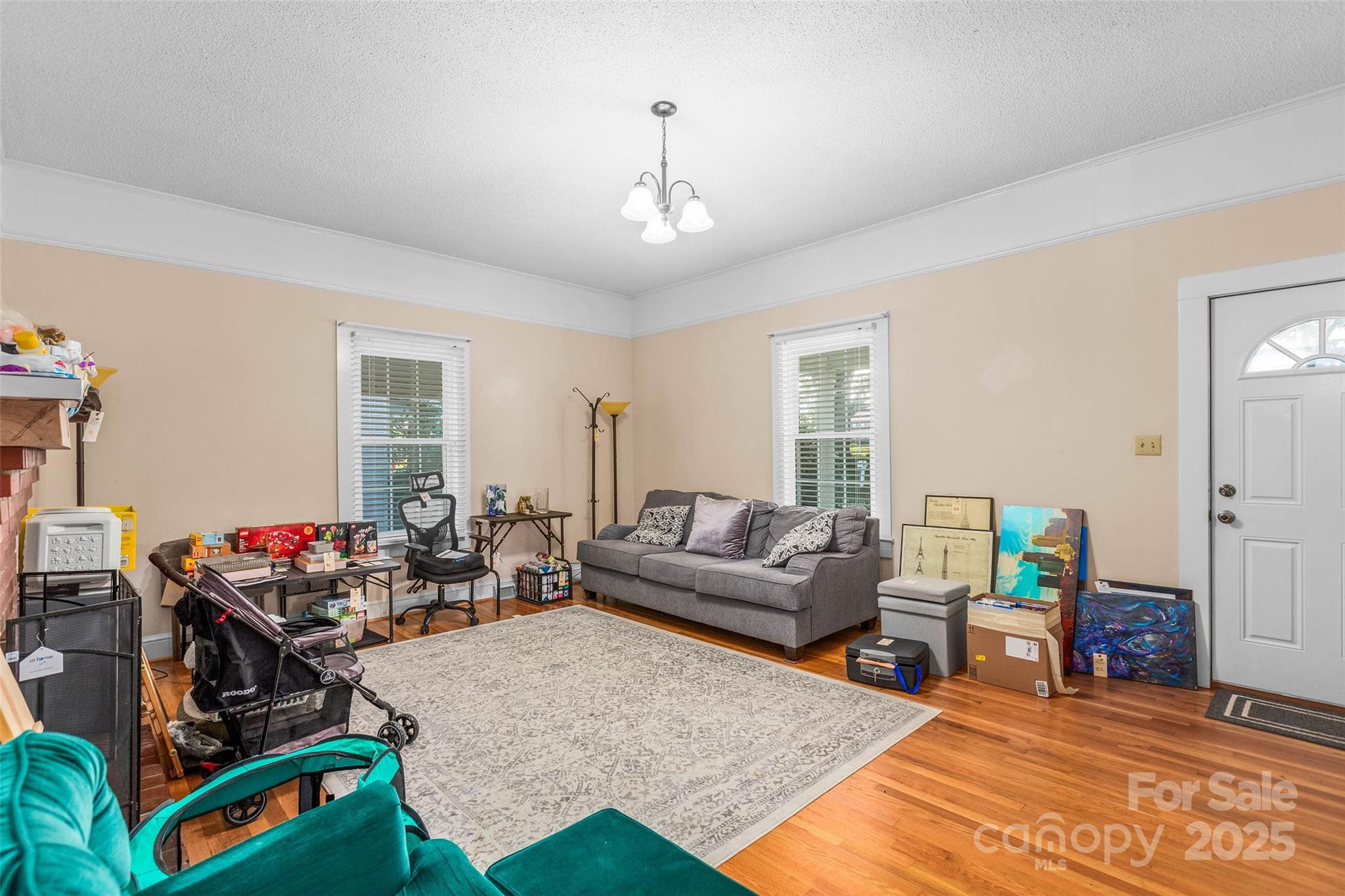 304 South Walnut Street Kannapolis, NC 28081 - Photo 8 of 32 a living room with furniture a rug and a window
