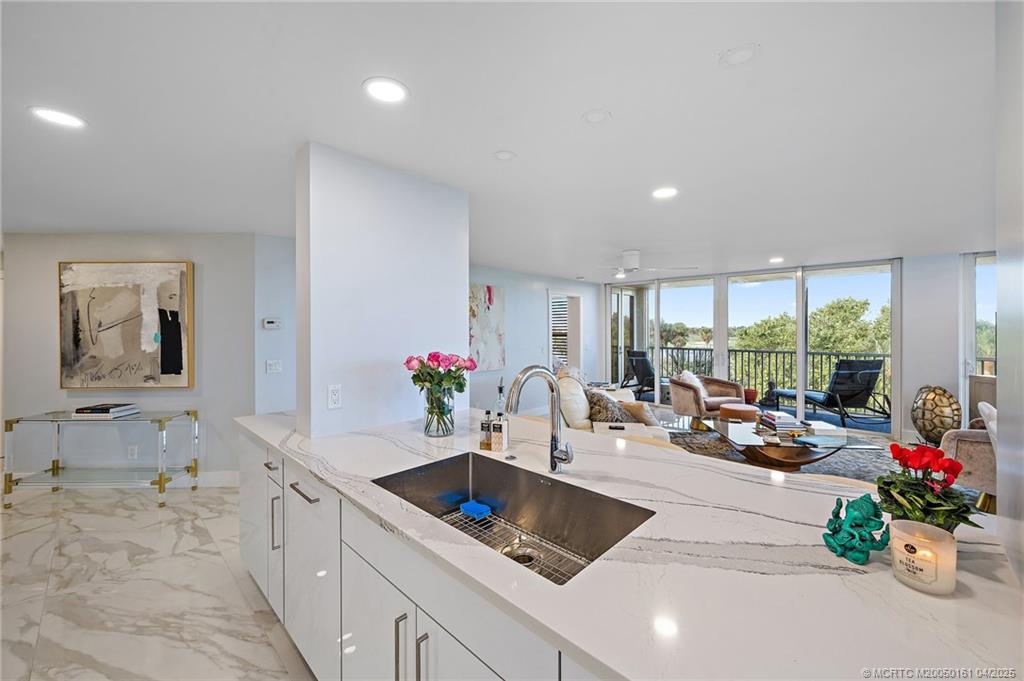 669 Northeast Plantation Road, Unit 201 Stuart, FL 34996 - Photo 13 of 37 a very nice looking room with a large window