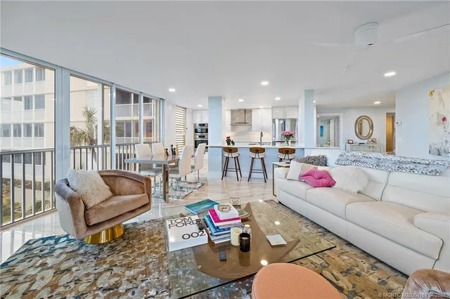 a balcony with furniture and wooden floor