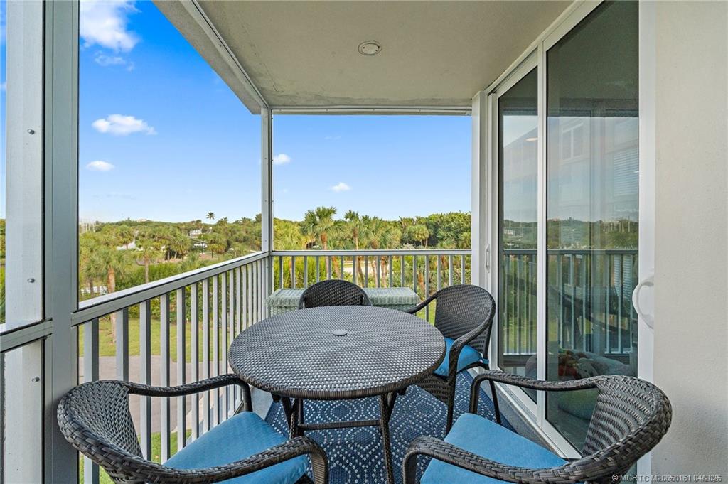 669 Northeast Plantation Road, Unit 201 Stuart, FL 34996 - Photo 23 of 37 a view of a room with furniture and wooden floor