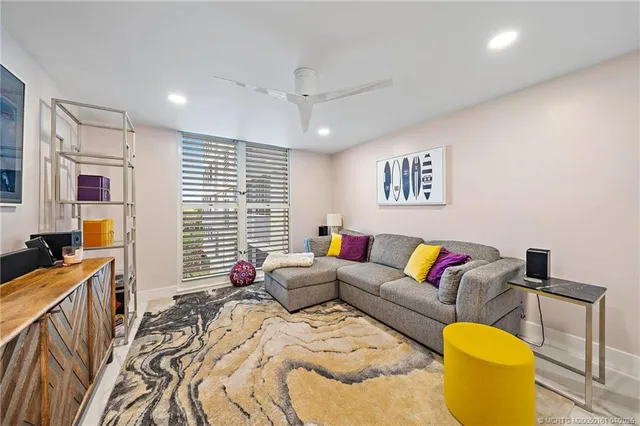 a spacious bedroom with a bed a couch and dresser