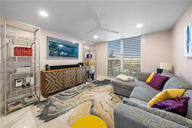a bathroom with a granite countertop sink a toilet and a mirror