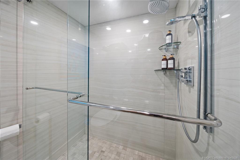 669 Northeast Plantation Road, Unit 201 Stuart, FL 34996 - Photo 33 of 37 a bathroom with a shower