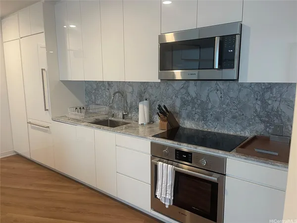 a kitchen with a stove and a microwave