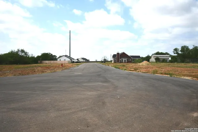 a view of a road with an ocean view