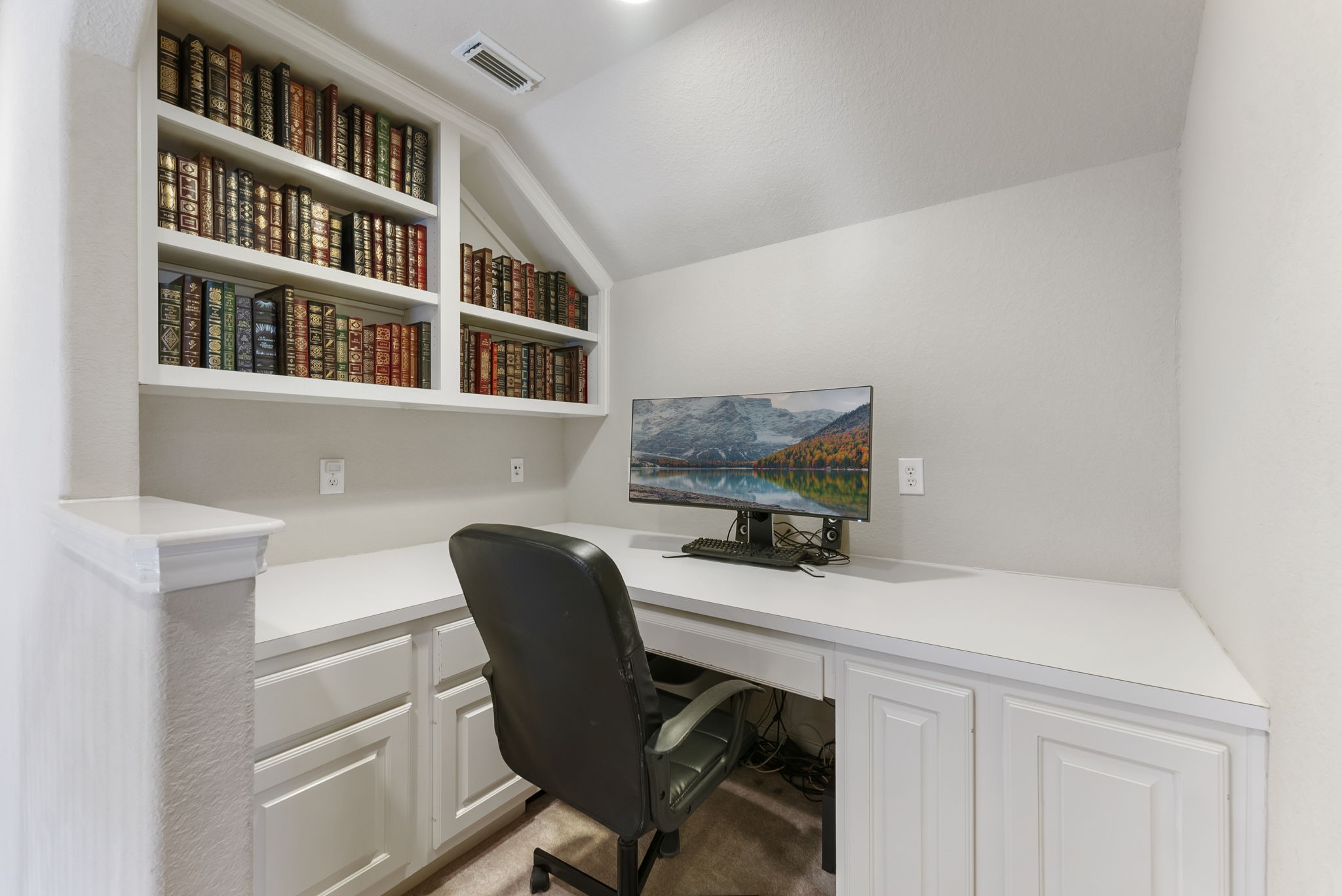 19223 Senterra Lakes Boulevard Spring, TX 77379 - Photo 28 of 48 a workspace with furniture and paintings on the wall
