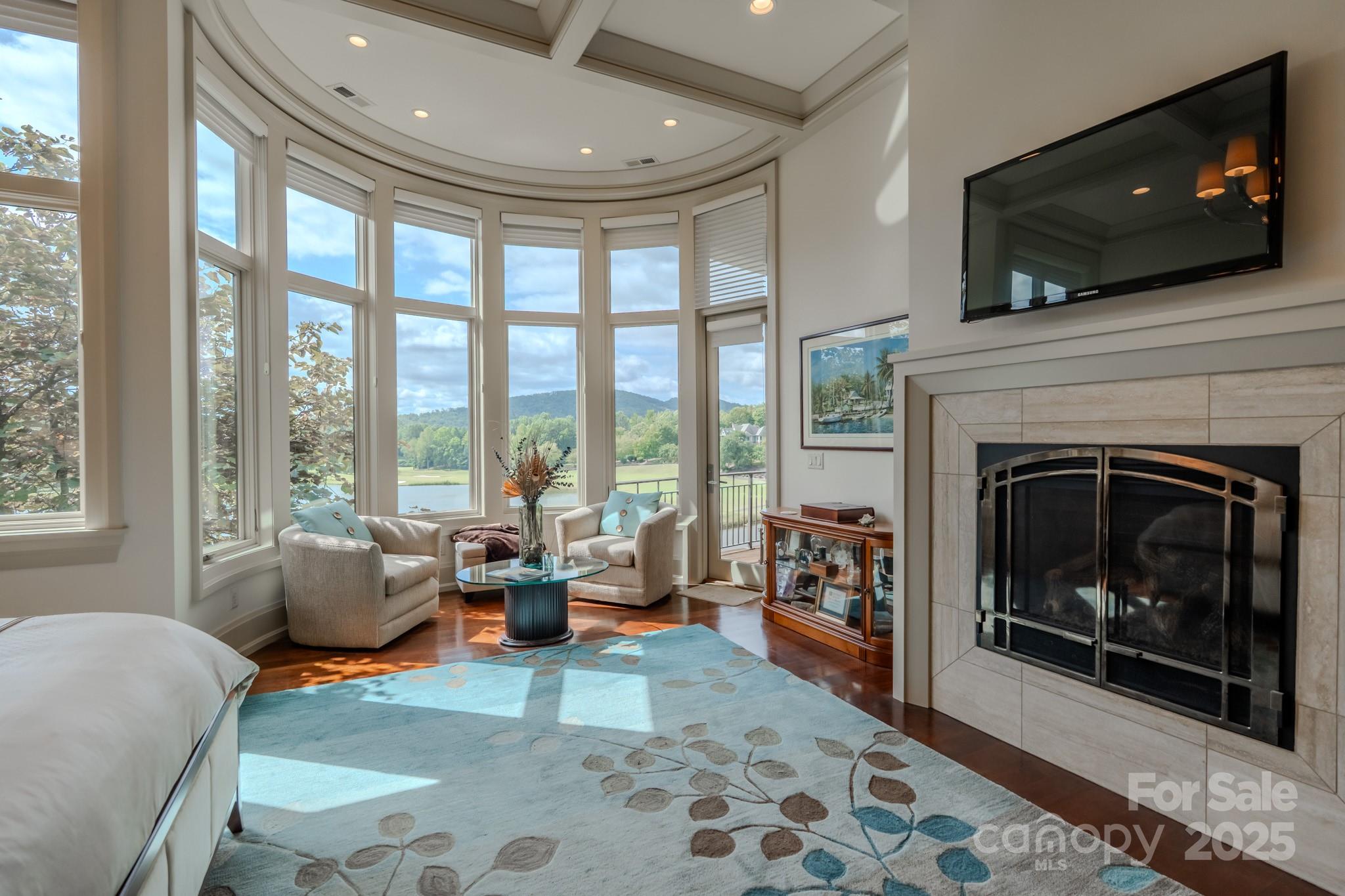 15 Water View Court Travelers Rest, SC 29690 - Photo 21 of 48 a living room with furniture a flat screen tv and a fireplace
