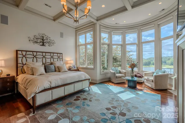 a spacious bedroom with a bed and large windows