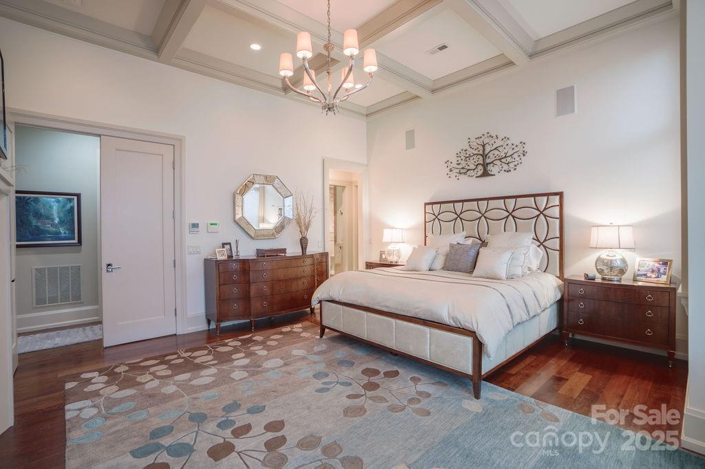 15 Water View Court Travelers Rest, SC 29690 - Photo 23 of 48 a bedroom with a bed and a chandelier