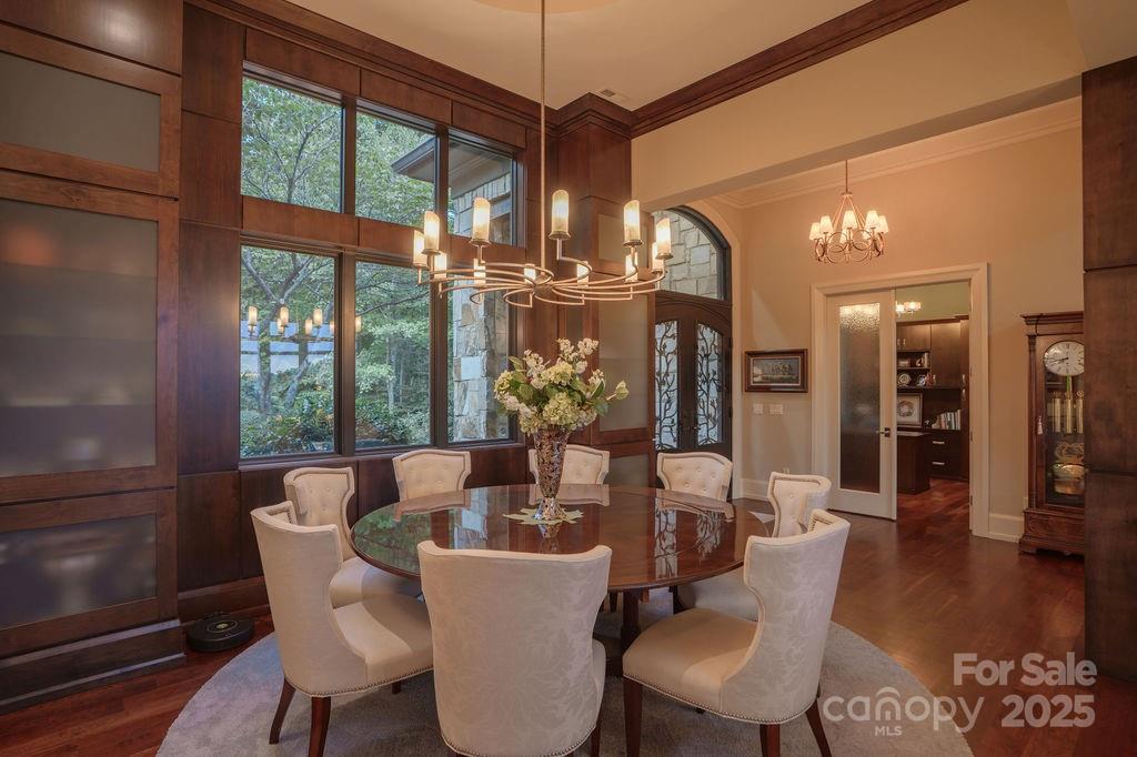 15 Water View Court Travelers Rest, SC 29690 - Photo 30 of 48 a dining room with furniture a chandelier and wooden floor