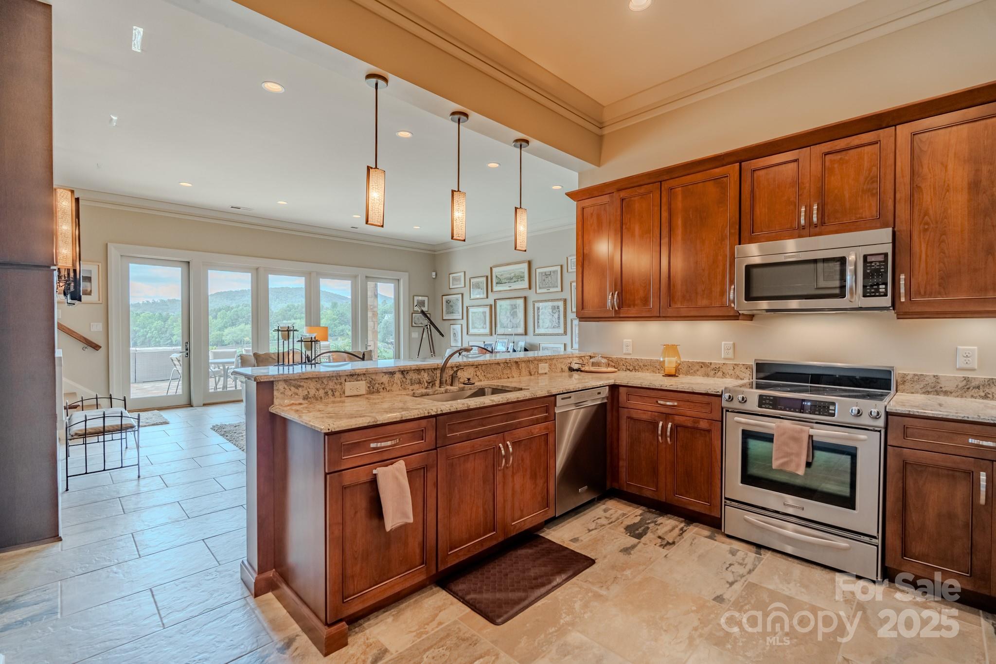 15 Water View Court Travelers Rest, SC 29690 - Photo 32 of 48 a kitchen with stainless steel appliances granite countertop a stove and a sink