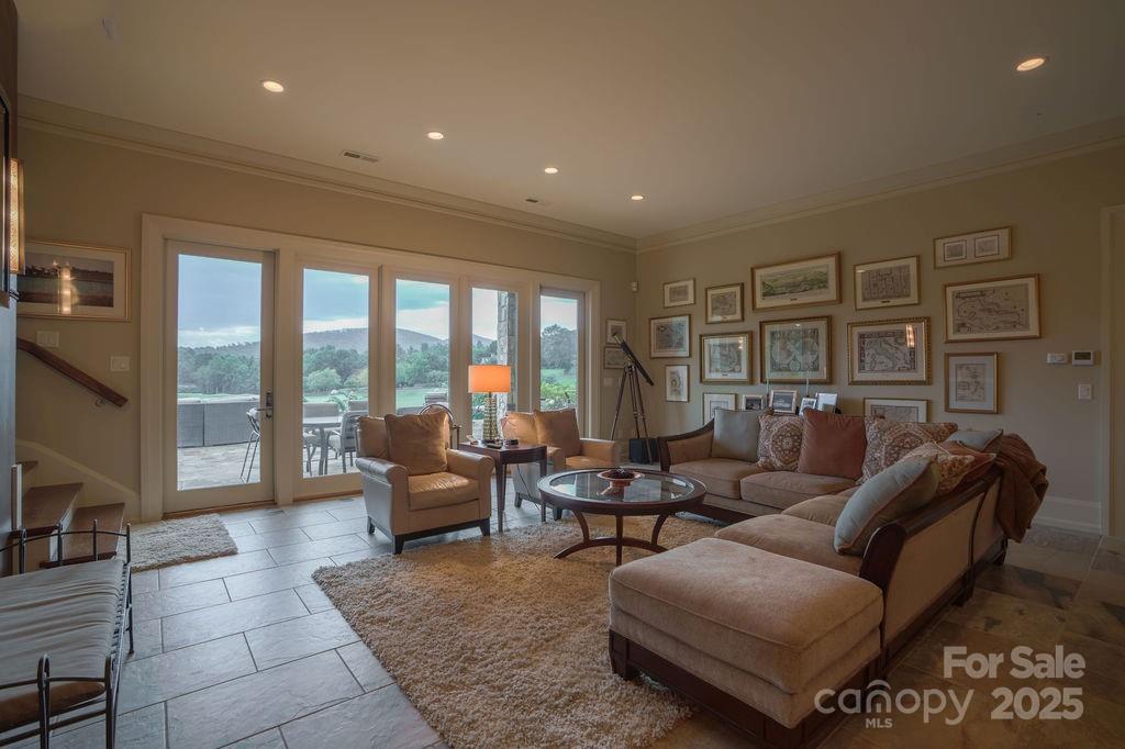 15 Water View Court Travelers Rest, SC 29690 - Photo 33 of 48 a living room with furniture and a floor to ceiling window