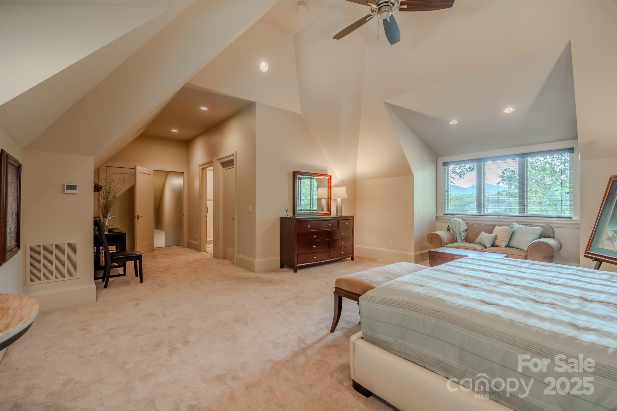 15 Water View Court Travelers Rest, SC 29690 - Photo 38 of 48 a bedroom with a bed a mirror and furniture