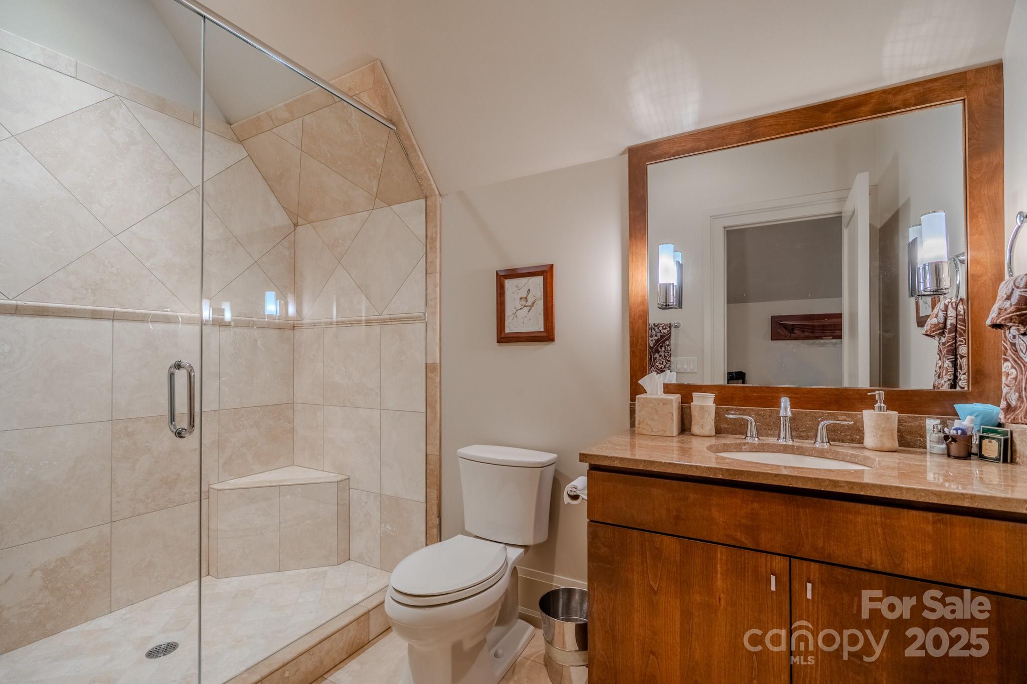 15 Water View Court Travelers Rest, SC 29690 - Photo 39 of 48 a bathroom with a granite countertop sink toilet and shower