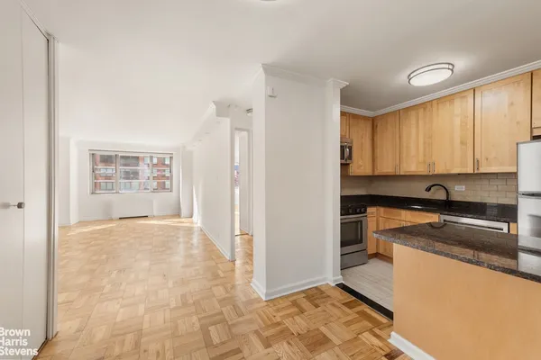 a view of a kitchen with a sink and dishwasher cabinets