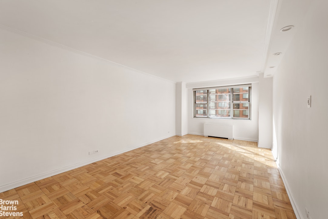 300 East 40th Street, Unit 12P Manhattan, NY 10016 - Photo 3 of 13 a view of an empty room with a window