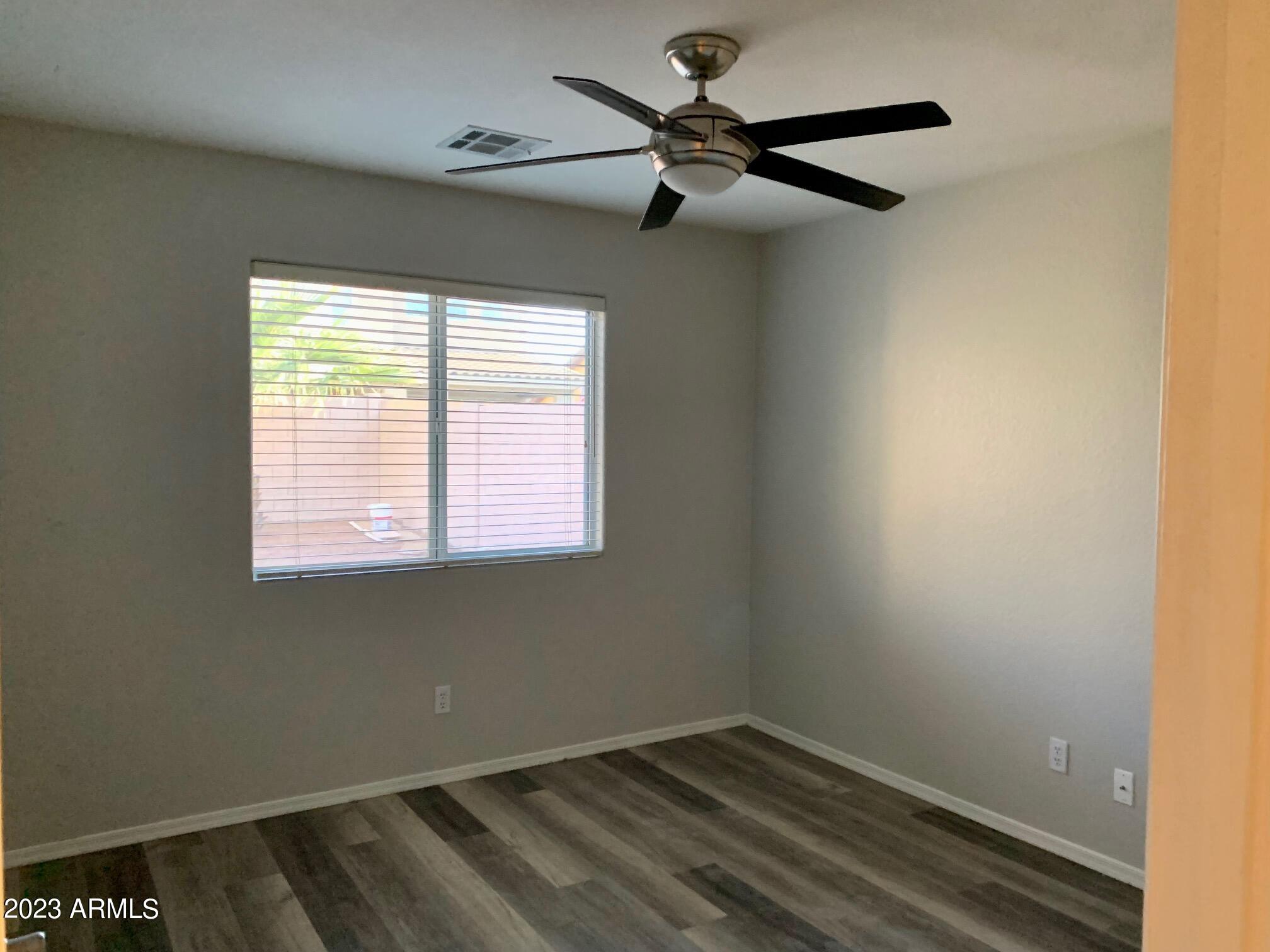 1655 East Harrison Street Chandler, AZ 85225 - Photo 18 of 35 a view of a room with a ceiling fan and a window