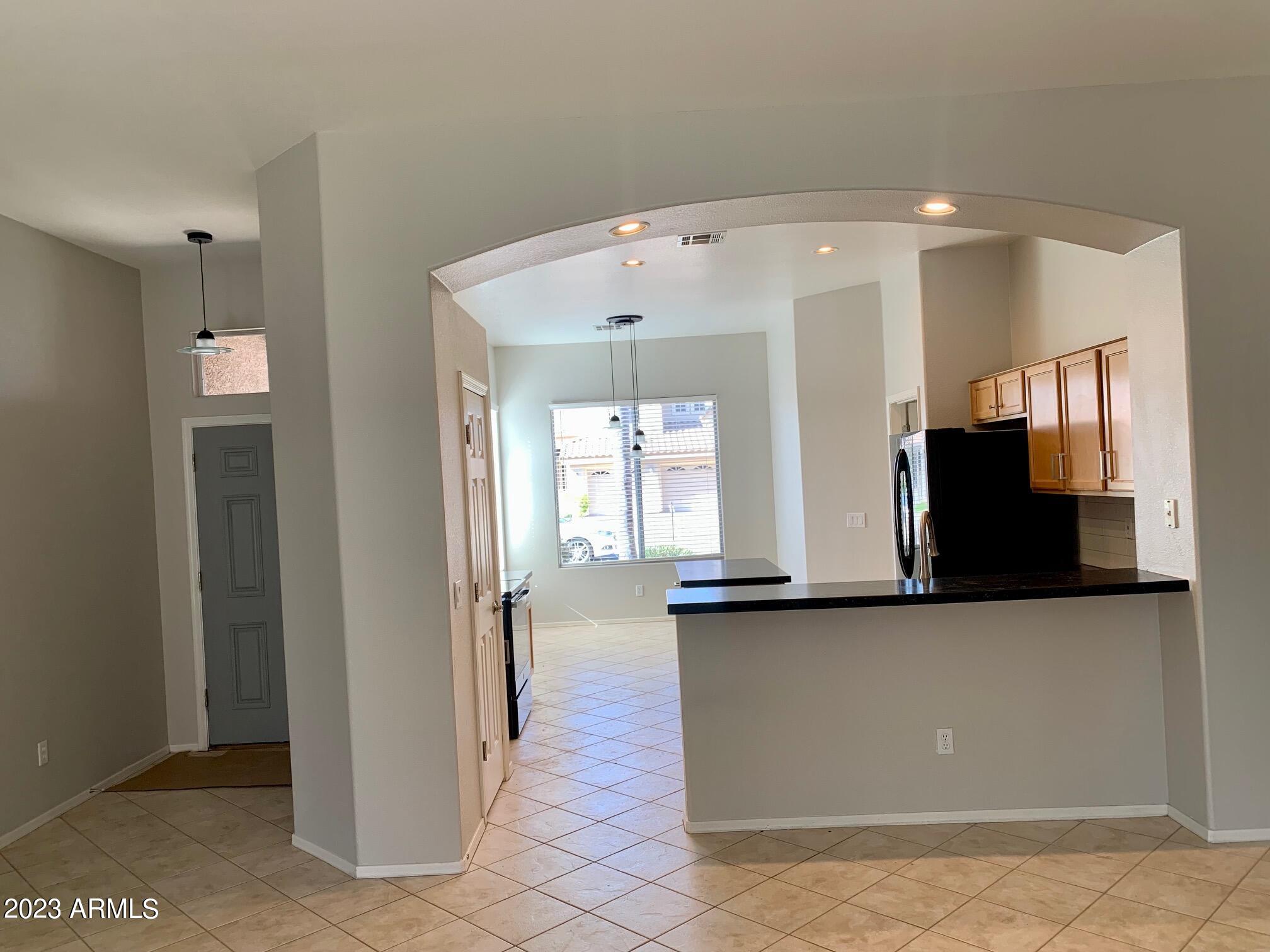 1655 East Harrison Street Chandler, AZ 85225 - Photo 19 of 35 a view of a hallway with wooden floor and a living room
