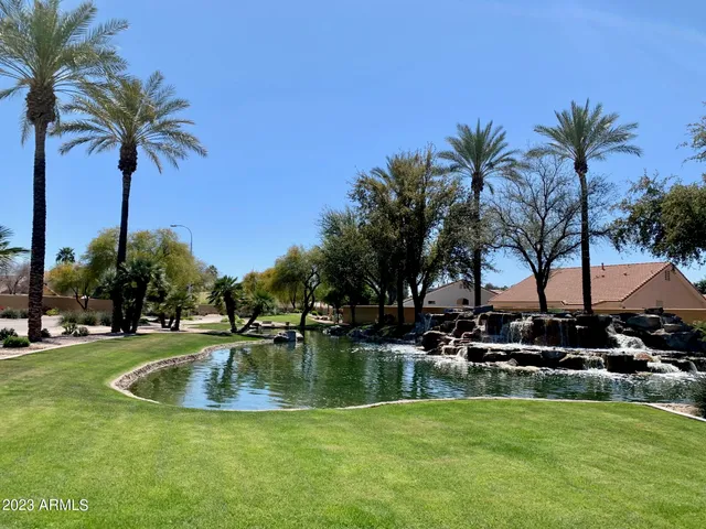 a view of a swimming pool with a table and chairs