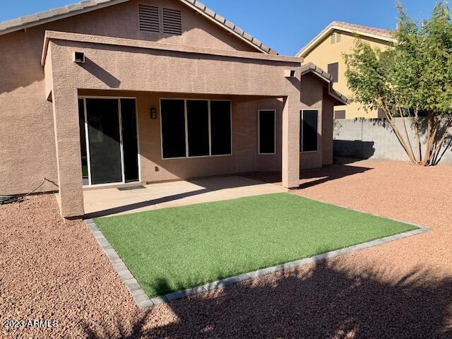 1655 East Harrison Street Chandler, AZ 85225 - Photo 23 of 35 a view of a house with a yard