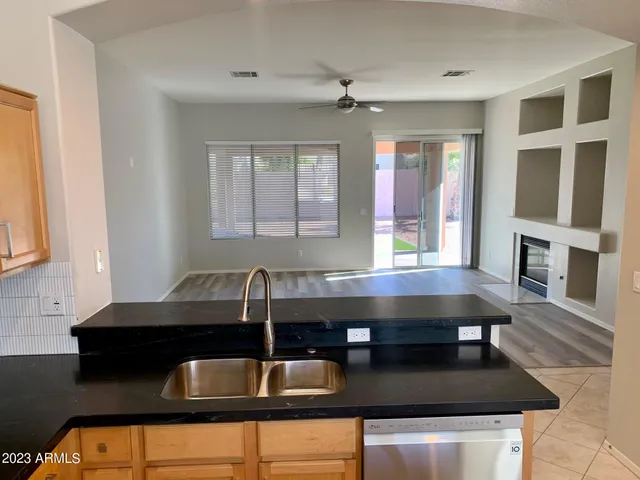 a kitchen with a table chairs and microwave