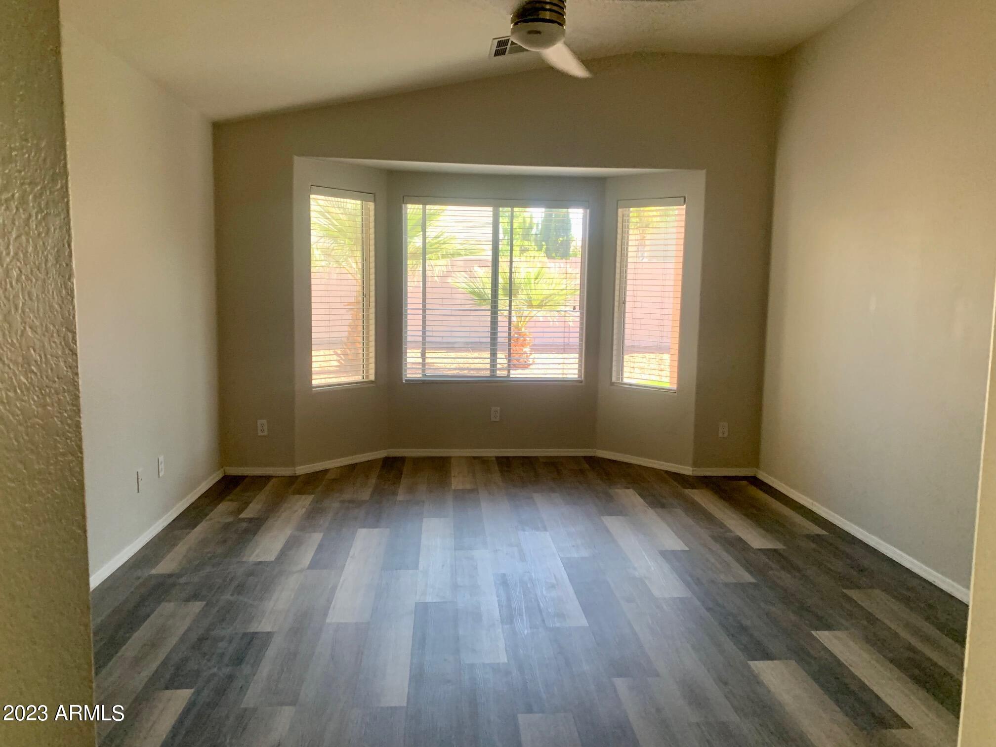 1655 East Harrison Street Chandler, AZ 85225 - Photo 28 of 35 an empty room with wooden floor and windows