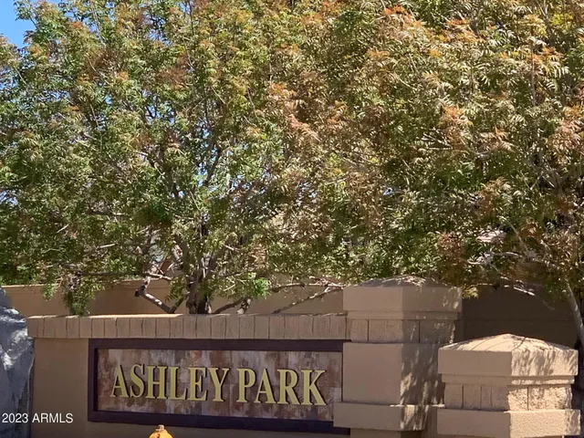 a view of a swimming pool with a table and chairs