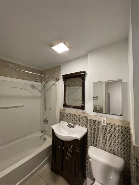 5 Freeland Terrace Worcester, MA 01603 - Photo 14 of 35 a bathroom with a sink a toilet a mirror and bathtub
