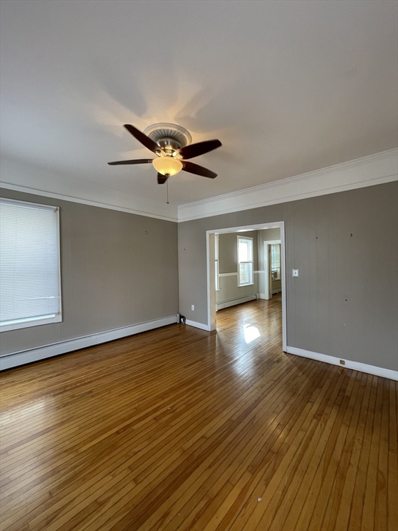 5 Freeland Terrace Worcester, MA 01603 - Photo 7 of 35 a view of an empty room with wooden floor and a window