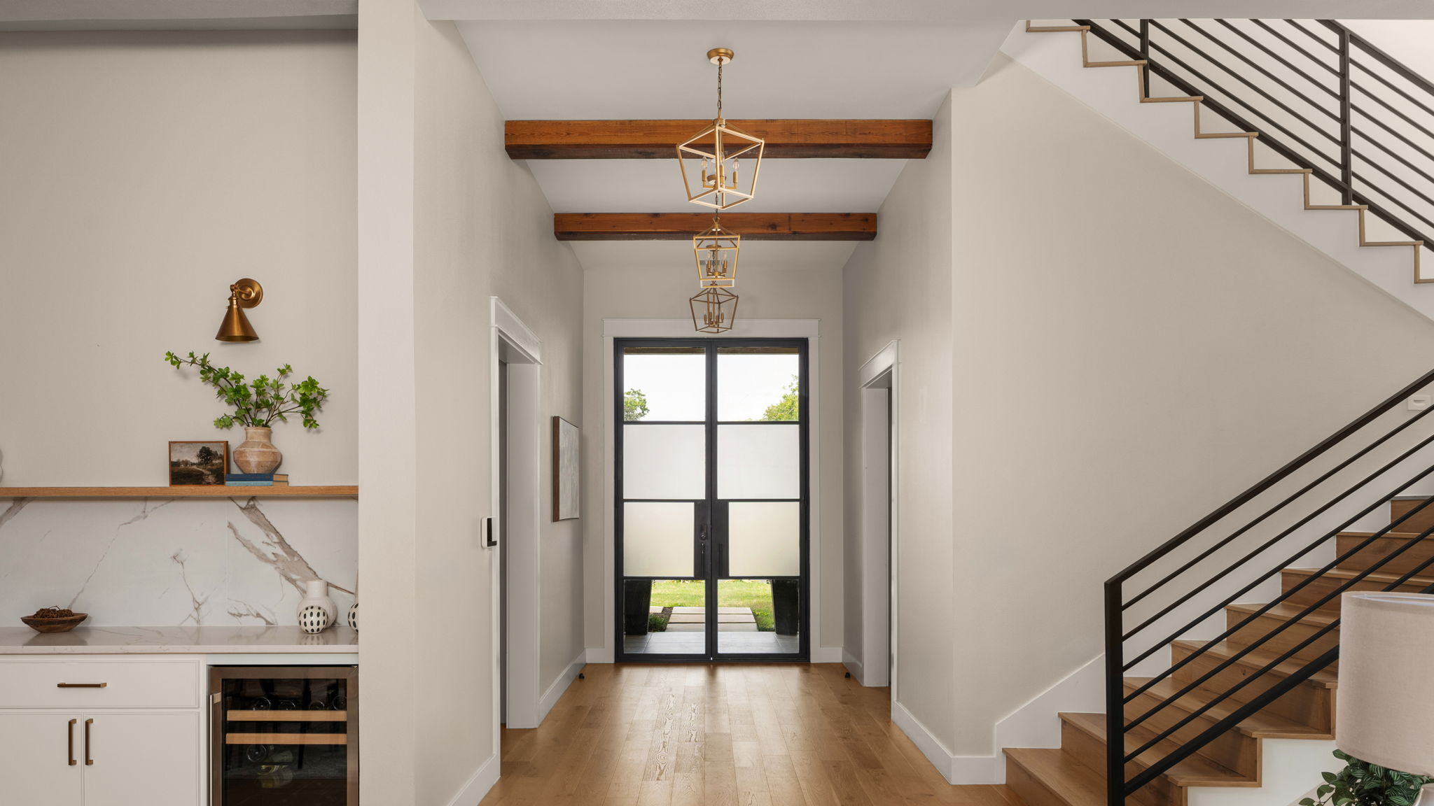 1909 West 40th Street Austin, TX 78731 - Photo 5 of 40 a view of a hallway with wooden floor and staircase